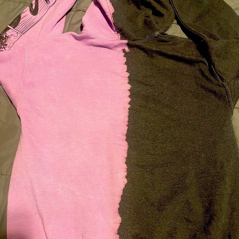 Gently used purple and black “Broken Promises “ sweater in size Medium.